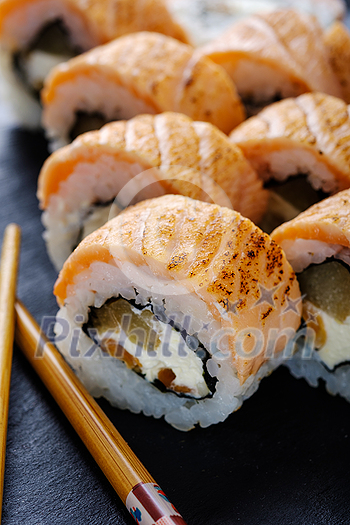 Fresh and tasty traditional Japanese sushi rolls close up Fresh and tasty traditional Japanese sushi rolls close up