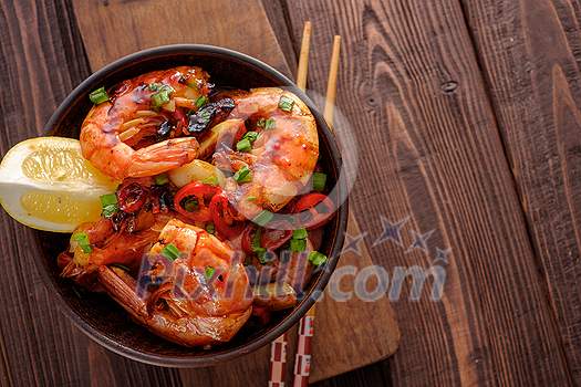 Large grilled BBQ shrimp with sweet chili sauce, green onion and lemon, copyspace. Large grilled BBQ shrimp with sweet chili sauce, green onion and lemon, copyspace.