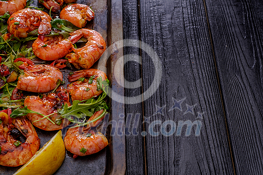 Large grilled BBQ shrimp with sweet chili sauce, green onion and lemon, copyspace. Large grilled BBQ shrimp with sweet chili sauce, green onion and lemon, copyspace.
