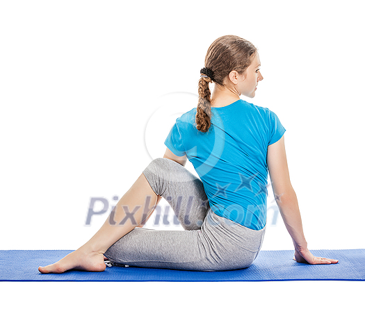 Yoga - young beautiful slender woman yoga instructor doing Half Lord of the Fishes Pose (Half Spinal Twist Pose) (Ardha Matsyendrasana) asana exercise isolated on white background Yoga - young beautiful slender woman yoga instructor doing Half Lord of the Fishes Pose (Half Spinal Twist Pose) (Ardha Matsyendrasana) asana exercise isolated on white background