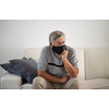 Senior man wearing  a facemask during coronavirus and flu outbreak. Virus and illness protection, home quarantine. COVID-19 concept