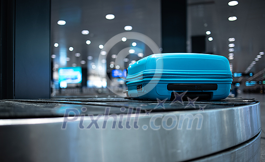Young woman with her luggage at an international airport, before going through the check-in and the security check before her flight Young woman with her luggage at an international airport, before going through the check-in and the security check before her flight