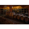 Winery cellar with wooden wine barrels. Crete island, Greece