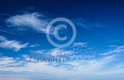 Blue clear sky with white cirrus spindrift clouds background Blue clear sky with white cirrus spindrift clouds background