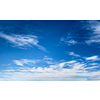 Blue clear sky with white cirrus spindrift clouds background