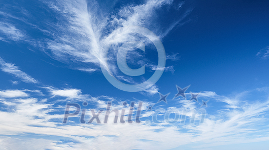 Blue clear sky with white cirrus spindrift clouds background Blue clear sky with white cirrus spindrift clouds background