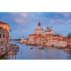 View of Venice Grand Canal with boats and Santa Maria della Salute church on sunset from Ponte dell'Accademia bridge. Venice, Italy