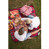 Couple in love enjoying picnic time drink and food in beautiful nature on the river bank top view