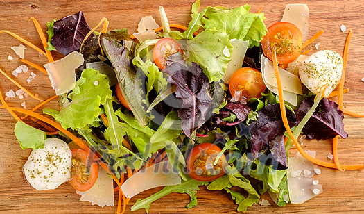 Healthy food. Fresh salad tomato, cheese and greens, top view. Healthy food. Fresh salad tomato, cheese and greens, top view.