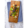 Healthy food. Fresh salad  tomato, cheese and greens on the cutting board, top view. 