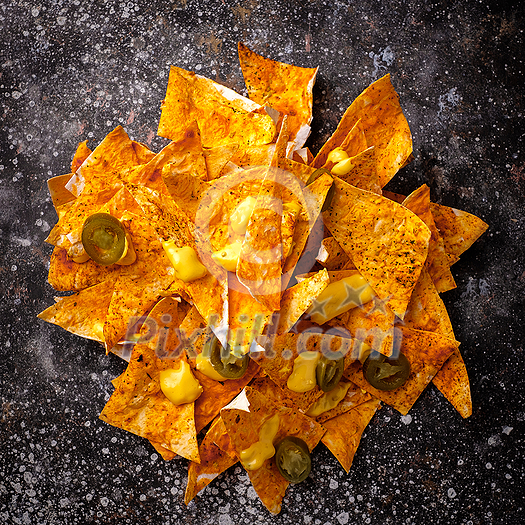 Nachos chips with mustard and jalapeno Nachos chips with mustard and jalapeno