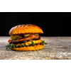Fresh juicy delicious homemade burger. Hamburger with meat and fresh herbs.
