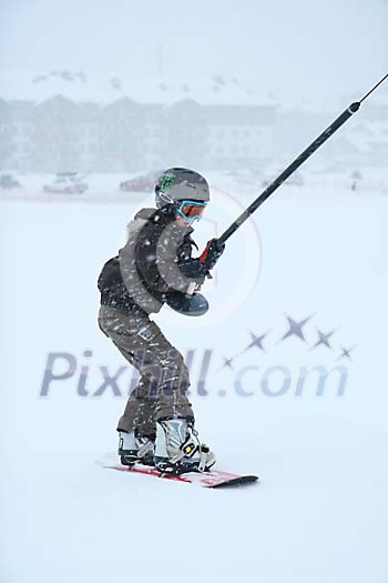 Boy catching a ride from the ski lift