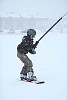 Boy catching a ride from the ski lift